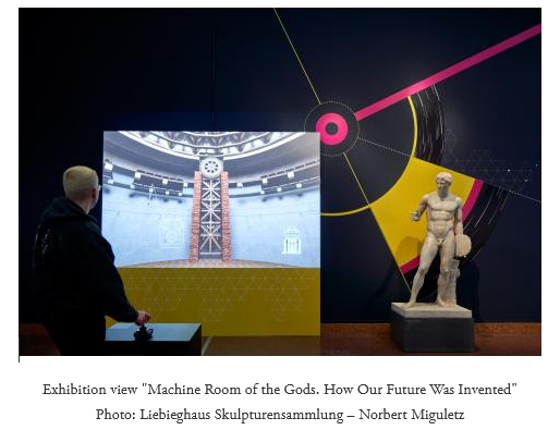 Museum visitor operating an interactive exhibit of "Machine Room of the Gods" at the Liebieghaus