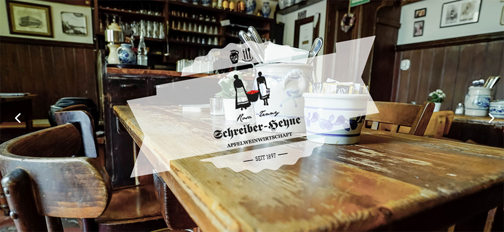 A wooden table in a traditional Frankfurt apple wine pub, with the name and some details of the Schreiber-Heyne restaurant as an overlay